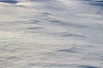 White background with snow ripples on snow in winter
