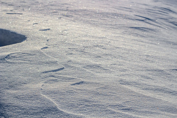 White background with snow ripples on snow in winter
