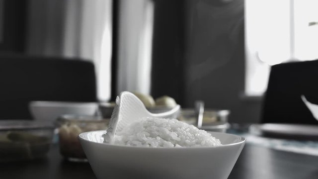 white rice in a plate and steam