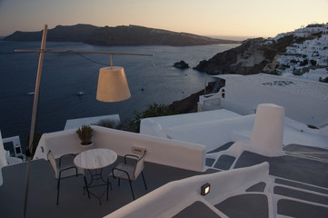 Restaurant table with a view at Oia town, Santorini island in Greece