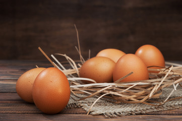 chicken eggs on wooden background
