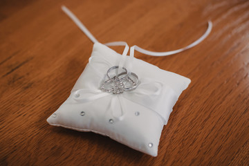 wedding rings in white gold on a beautiful pillow
