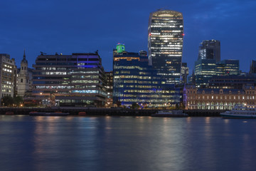 Fototapeta na wymiar Thames embankment and london skyscrapers in City of London in the night.