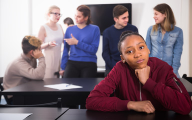 upset girl student feeling uncomfortable at break between classes