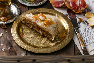 Close view of bastilla pie on copper plate
