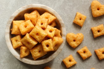 Homemade square Cheese Crackers in a bowl