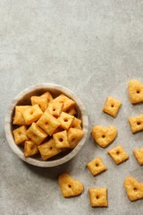 Homemade square Cheese Crackers in a bowl