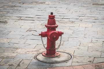 old hydrant on street - vintage red hydrant
