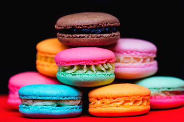 a lot of appetizing multicolored biscuits that lie on one another