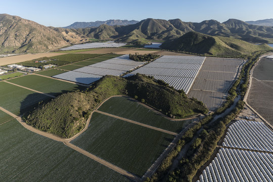 Aerial view of coastal farm fields and Santa Monica Mountains foothills near Camarillo in scenic Ventura County, California. 