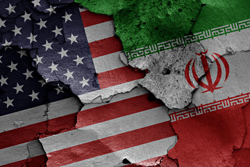flags of USA and Iran painted on cracked wall