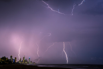Fototapeta na wymiar Lightning bolts in the sky in the Gold Coast during storm season
