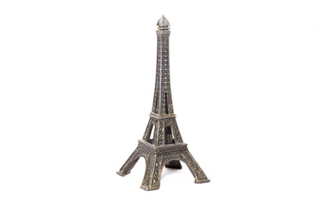 Fototapeta na wymiar Model Eifell tower made from brass on a white background