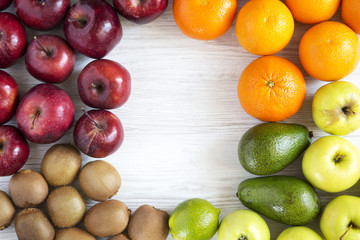 Set of raw fruits on white wooden background. Copy space. Top view. Flat lay.