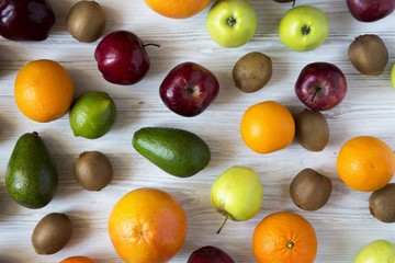 Set of fresh raw fruits on white wooden background. Top view. Flat lay.