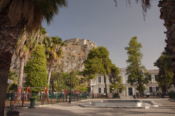Fototapeta na wymiar View over Palamidi fortress from the square near park in the old part of Nafplio town in Greece