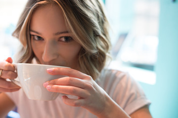 girl drinking from mug close 