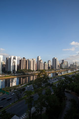 Fototapeta na wymiar View of the Pinheiros River and corporate buildings in the city of Sao Paulo.