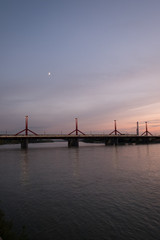 Rakoczi Bridge on the Danube in Budapest at sunset with moon above