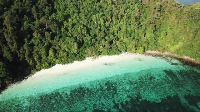 Aerial view from a drone of beautiful Nyaung Oo Phee island on sunny day in Myanmar
