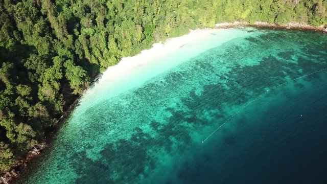 Aerial view from a drone of beautiful Nyaung Oo Phee island on sunny day in Myanmar
