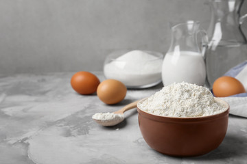 Bowl with flour on table