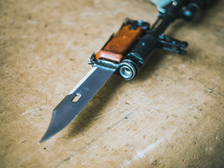 close up weapon bayonet knife on the auto rifle