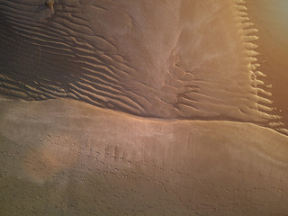 Patterns on wet beach sand