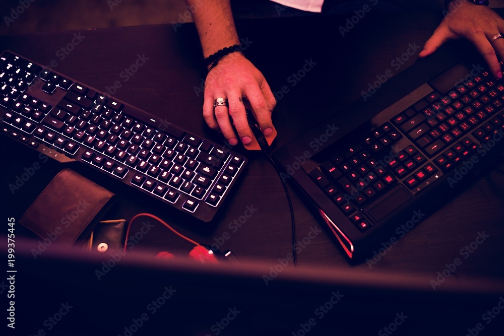 Poster closeup of hands working on computer keyboard