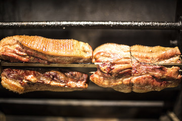 closeup of some meat skewers being grilled in a barbecue
