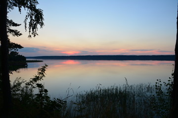 Sunset on the clam. Calm near Volga