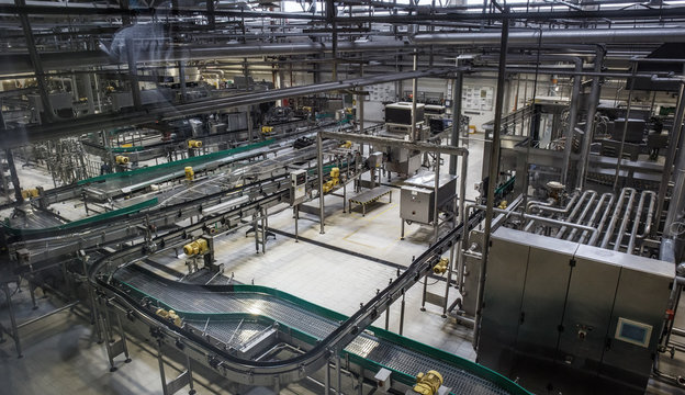 Brewery factory production line. Conveyor, pipeline and other industrial machinery, no people