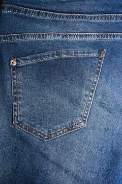 The texture is denim with a pocket   