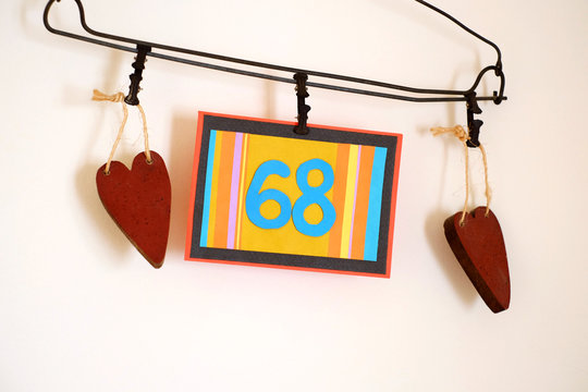 Number 68 anniversary celebration card against a bright white background