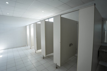 Obraz na płótnie Canvas public toilet urinals lined up, no privacy.