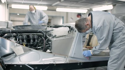 Sports car manufacturing quality control inspection room