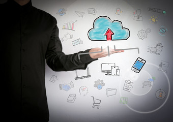 Cloud technology concep. Successful businessman at the light background.