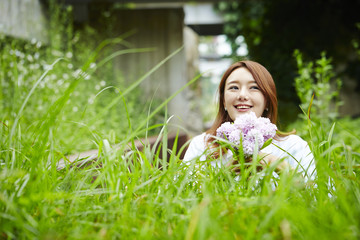 Korean girl holding flower bouquet