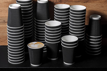 Many grey paper fast food disposable coffee cups