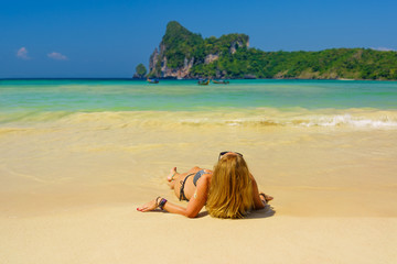 Fototapeta na wymiar woman resting at the tropical beach of Phi Phi Don