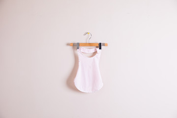 Baby clothes and accessories on wooden background