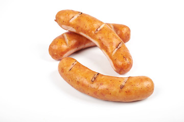 Grilled sausages isolated on a white background