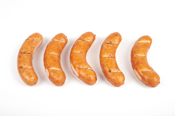 Grilled sausages isolated on a white background