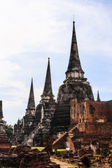 Fototapeta premium View of asian Thai religious architecture ancient Pagodas in Wat Phra Sri Sanphet Historical Park, Ayuthaya, Thailand, Southeast Asia. Thailand's top historic landmark, attraction and destination