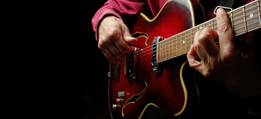 Guitarist hands and guitar close up. copy spaces.