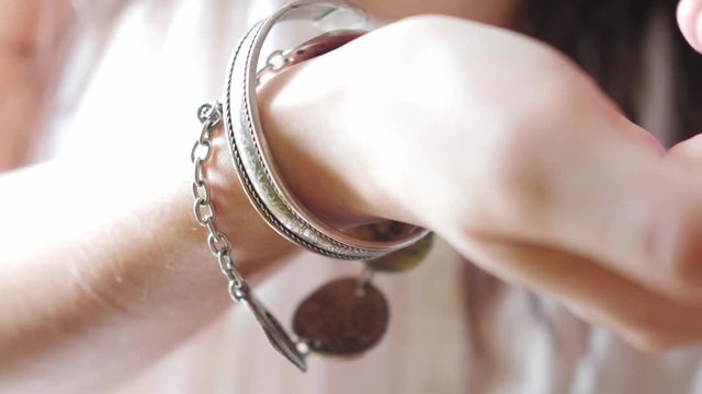 woman showing, silver bracelet on her hand