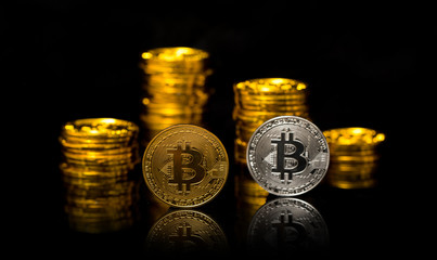 Bitcoin. Physical Bitcoin isolated on black background. Golden coin with bitcoin symbol isolated on black background with copy space. Digital currency