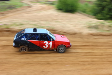 Obraz na płótnie Canvas Autocross in Russia, red-black sports car VAZ 2108 on a dirt track