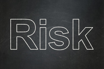 Obraz premium Finance concept: text Risk on Black chalkboard background