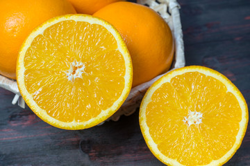 Juicy orange cut in half to make orange juice for Breakfast.